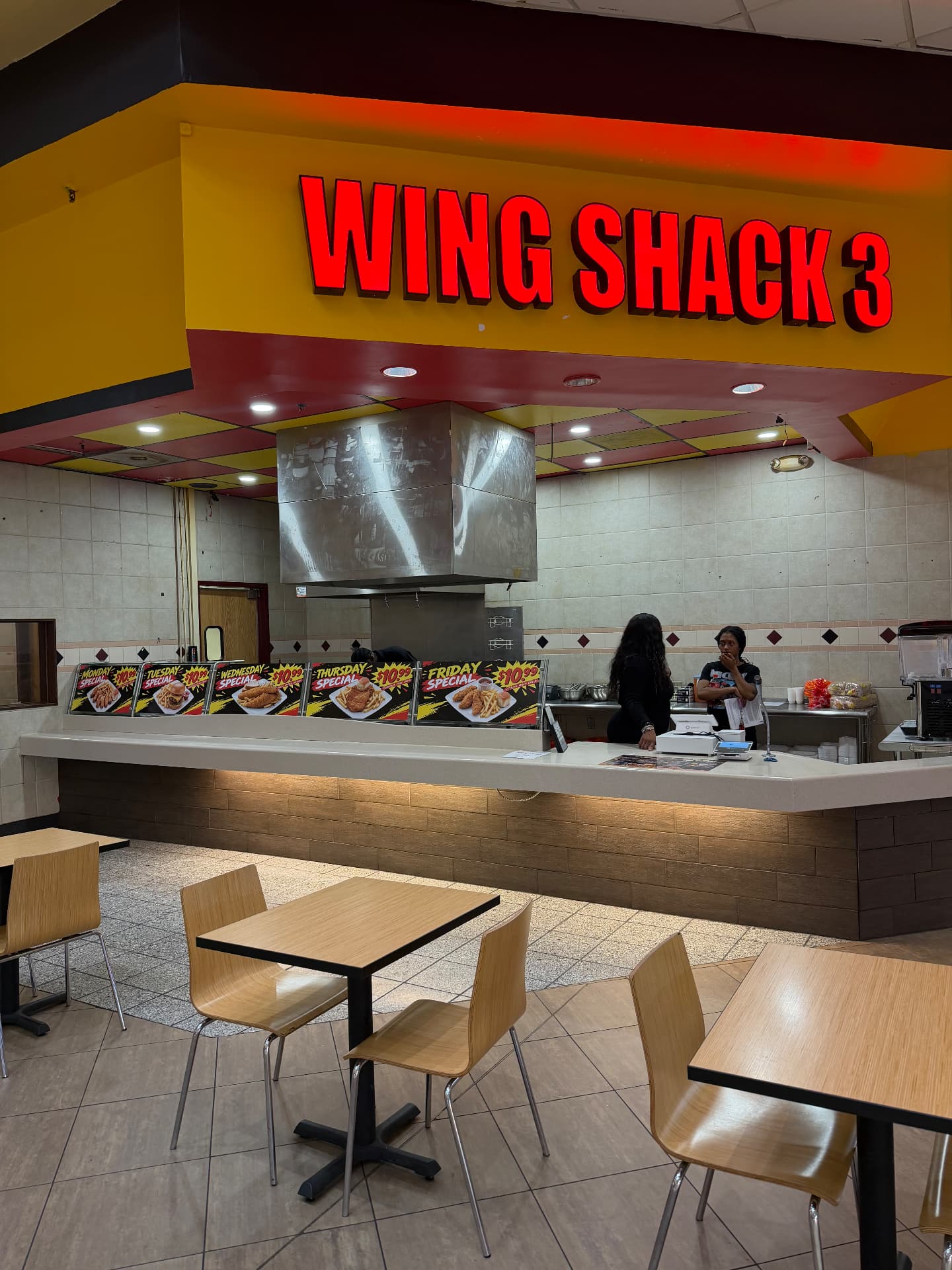 The Wing Shack 3 counter and sign inside the mall